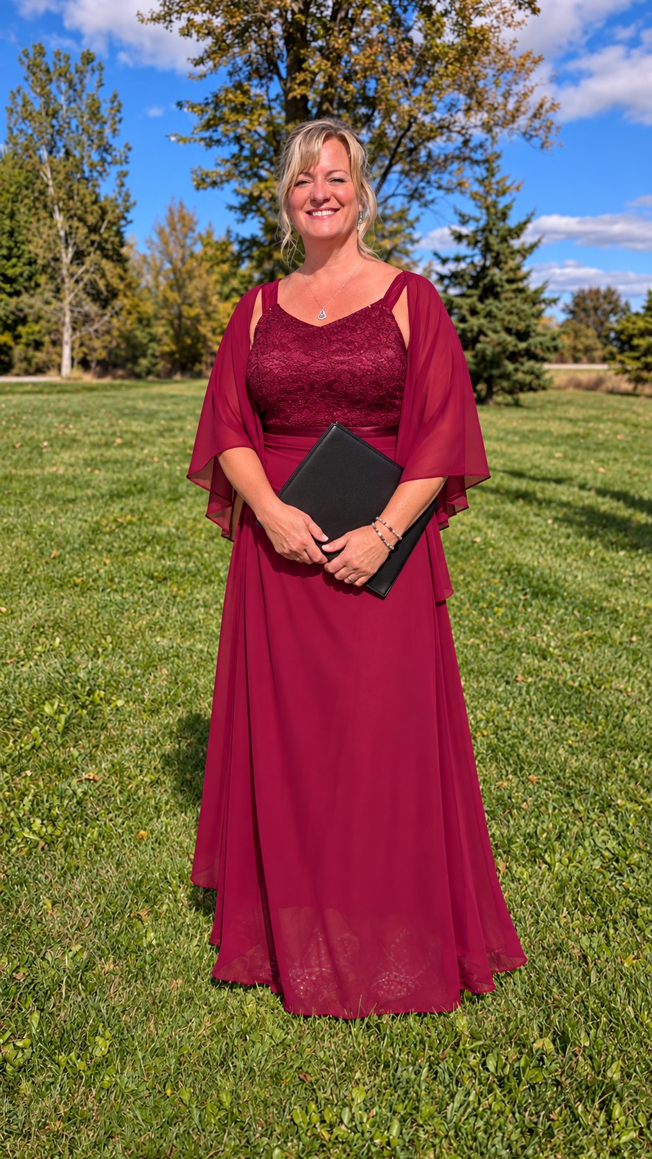 Created portrait of Tammy in her burgundy officiant dress, holding a ceremony folder